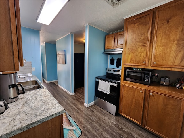 kitchen featuring dark hardwood / wood-style flooring, sink, stainless steel range with electric stovetop, black microwave, and a textured ceiling