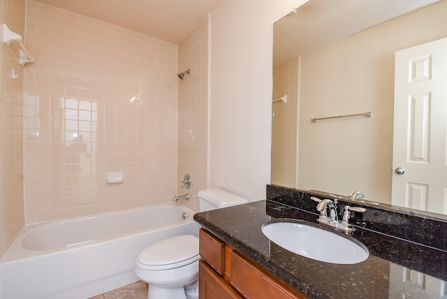 full bathroom with tiled shower / bath combo, vanity, and toilet