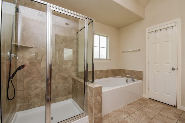 bathroom featuring separate shower and tub and tile patterned flooring