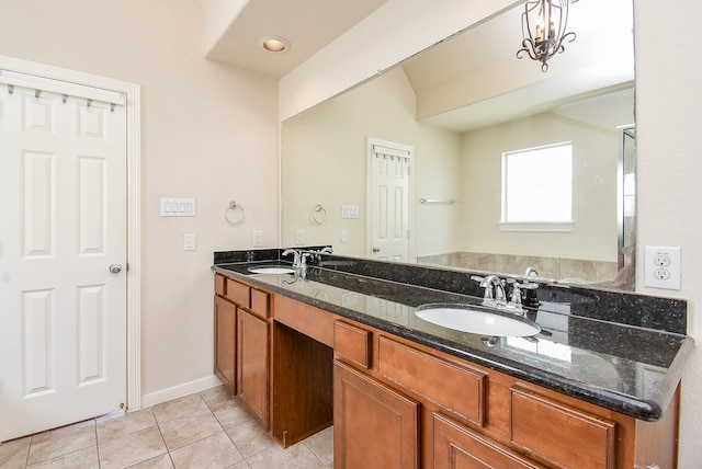 bathroom with tile patterned floors and vanity