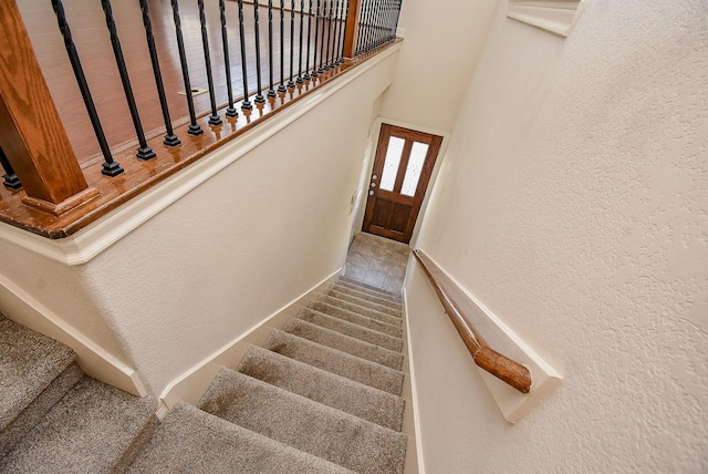 stairs with carpet flooring