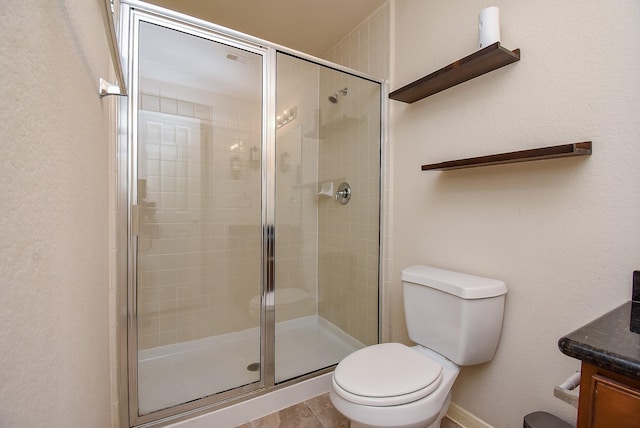 bathroom with walk in shower, vanity, and toilet