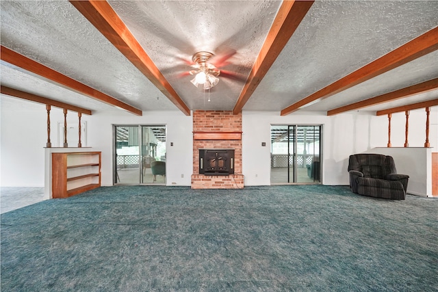 unfurnished living room featuring beamed ceiling, ceiling fan, carpet flooring, and a textured ceiling