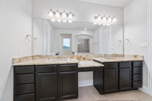 bathroom with tile patterned flooring and vanity