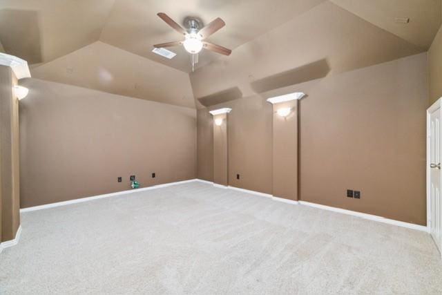 additional living space featuring light colored carpet, vaulted ceiling, and ceiling fan