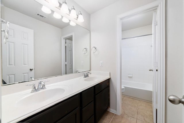 full bathroom with vanity, toilet, and washtub / shower combination