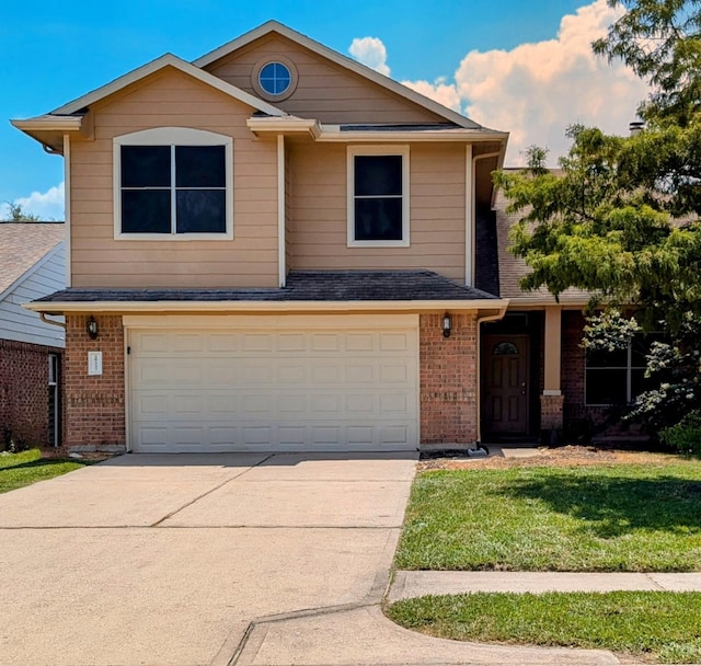 front of property featuring a garage and a front yard