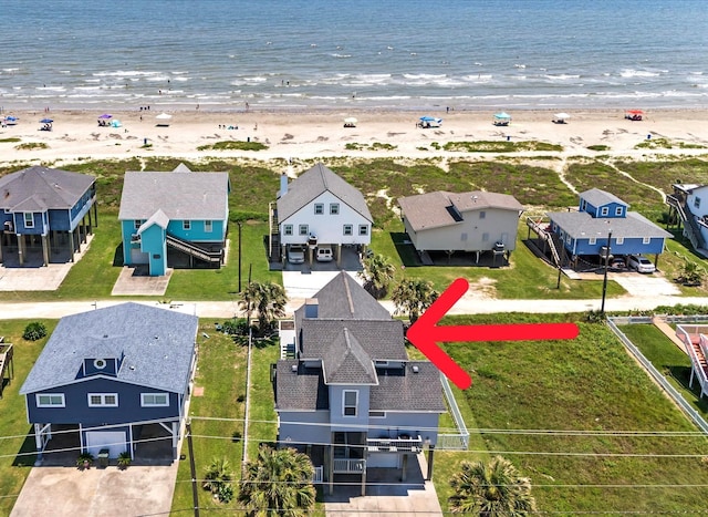 drone / aerial view with a view of the beach and a water view