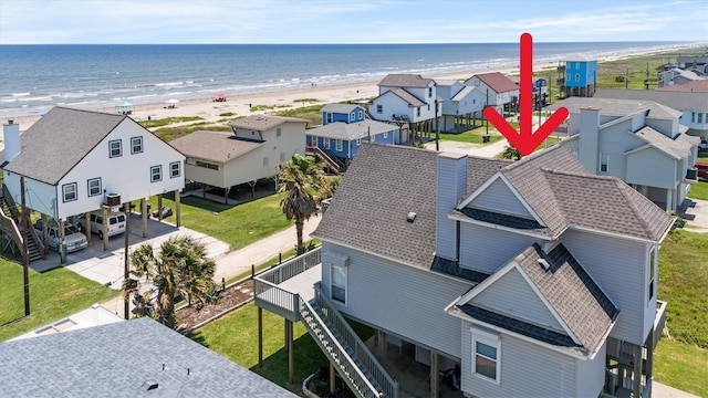 aerial view with a view of the beach and a water view