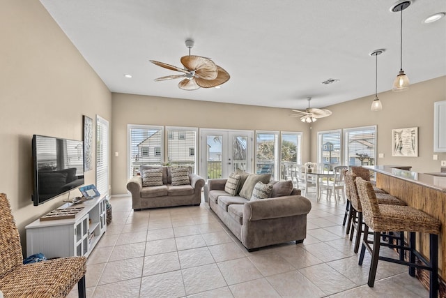 tiled living room with ceiling fan