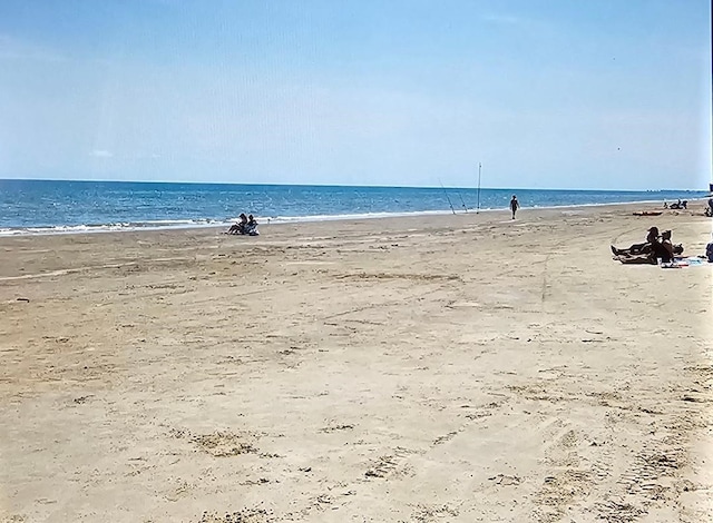 view of water feature with a beach view