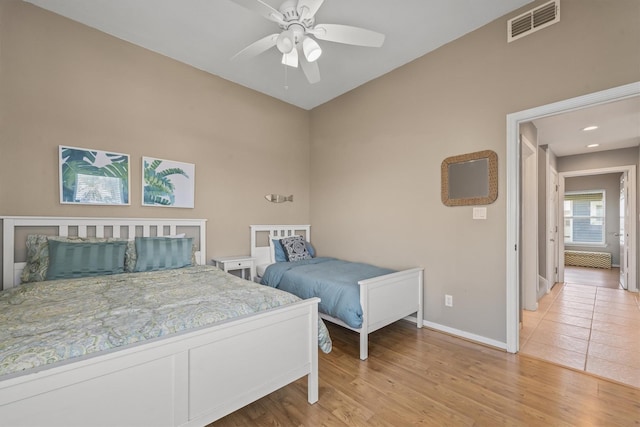 bedroom featuring light hardwood / wood-style floors and ceiling fan