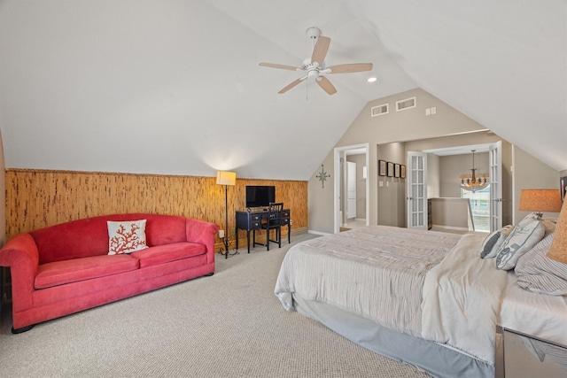 bedroom featuring carpet flooring, ceiling fan, and wood walls