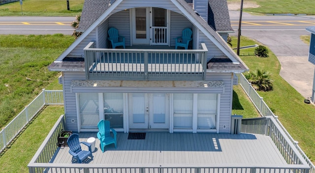 back of house featuring french doors and a balcony