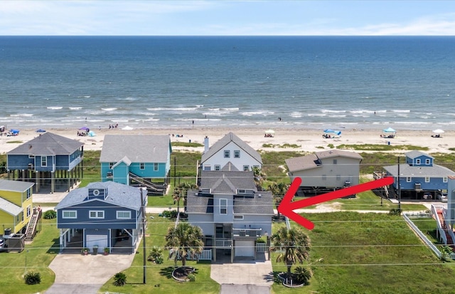 bird's eye view with a beach view and a water view