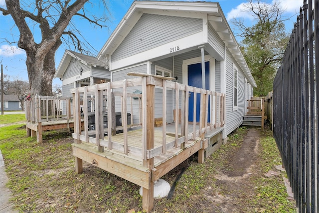 back of property with a wooden deck