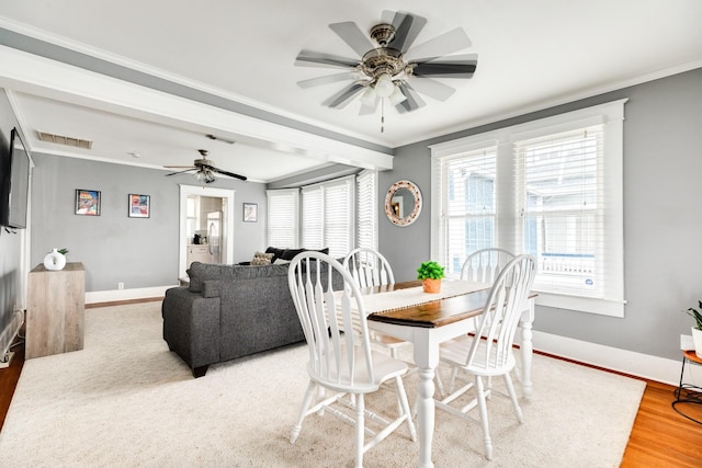 dining area featuring hardwood / wood-style flooring, ceiling fan, and ornamental molding