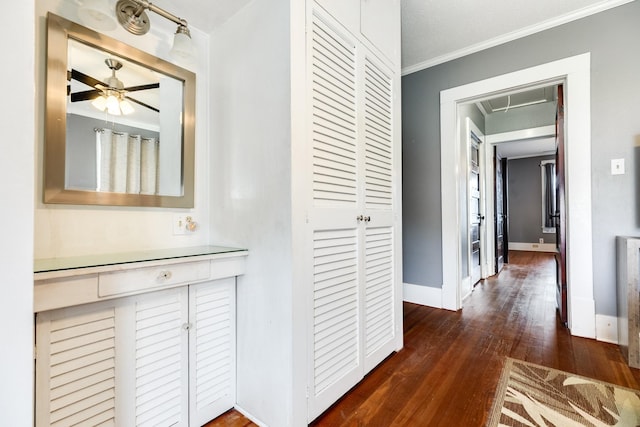 hall with crown molding and dark hardwood / wood-style flooring