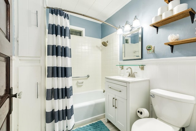 full bathroom featuring vanity, crown molding, shower / bath combination with curtain, and toilet