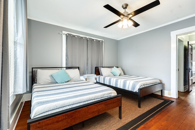 bedroom with ceiling fan, ornamental molding, and dark hardwood / wood-style floors