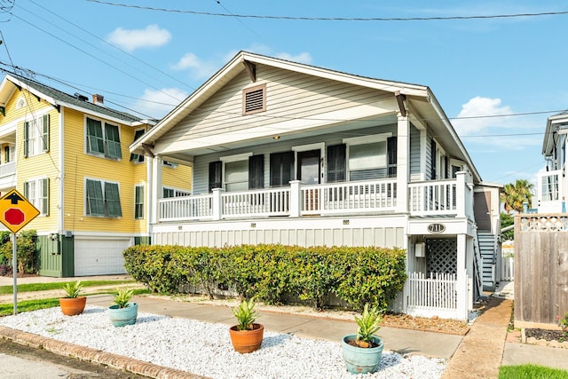 view of front of property featuring a garage and covered porch