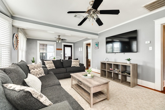 living room featuring crown molding and ceiling fan