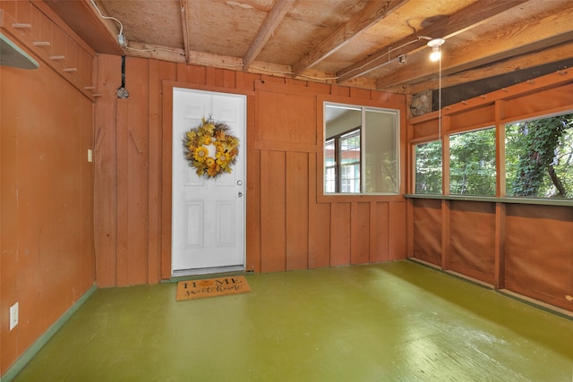 interior space featuring wood walls