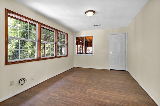 empty room featuring dark wood-type flooring