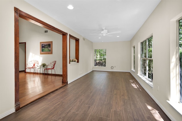 unfurnished room featuring dark hardwood / wood-style floors and ceiling fan