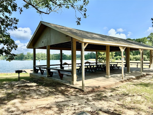 surrounding community featuring a water view