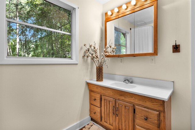 bathroom with vanity and a healthy amount of sunlight