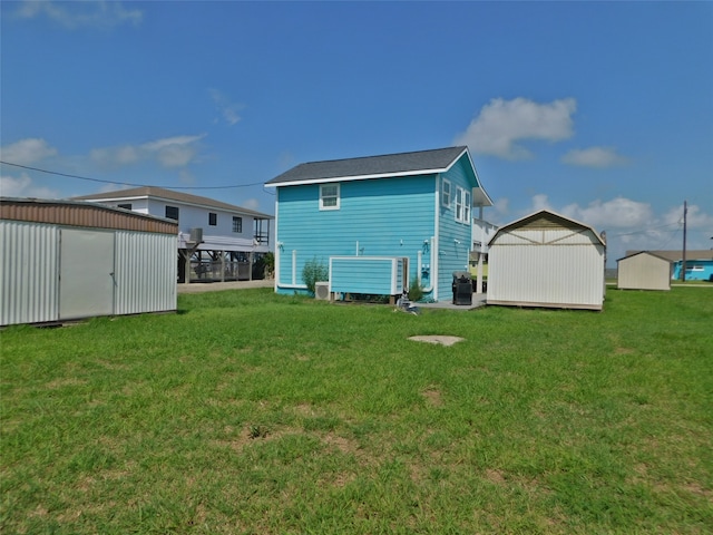 back of property with a shed and a lawn