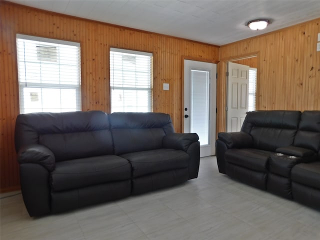 tiled living room featuring wooden walls