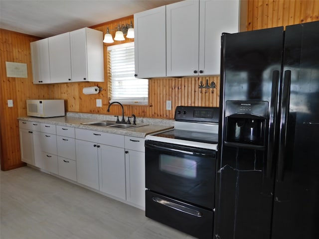 kitchen featuring black fridge with ice dispenser, sink, white cabinetry, and electric stove