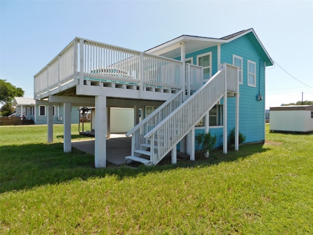 back of property with central AC, a deck, and a lawn