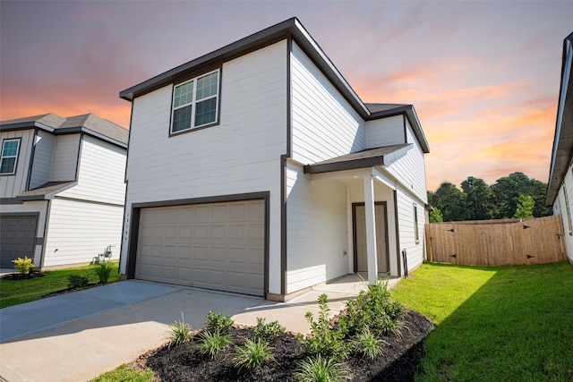 view of front of home featuring a yard and a garage