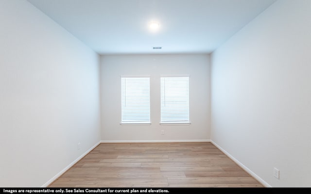 unfurnished room featuring light hardwood / wood-style floors