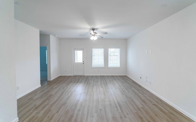 spare room with ceiling fan and light hardwood / wood-style floors