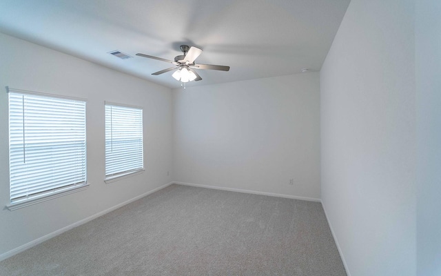 carpeted empty room with ceiling fan