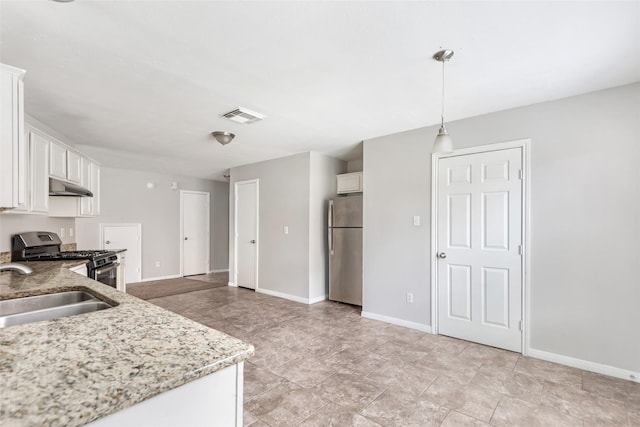 kitchen with white cabinetry, sink, pendant lighting, and stainless steel appliances