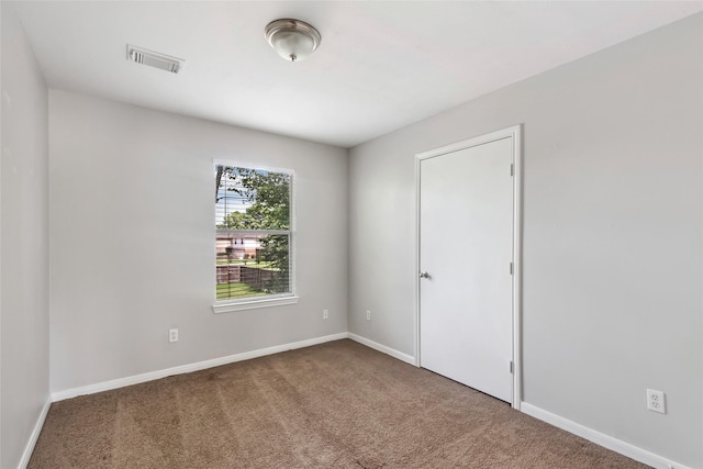 view of carpeted spare room