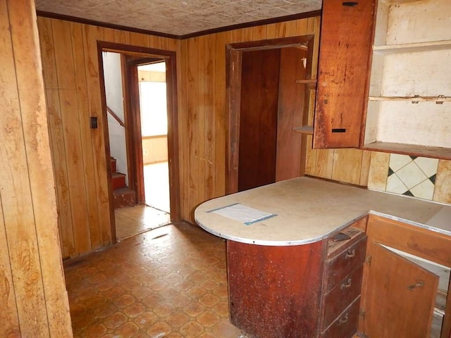 kitchen featuring tile patterned flooring and wooden walls