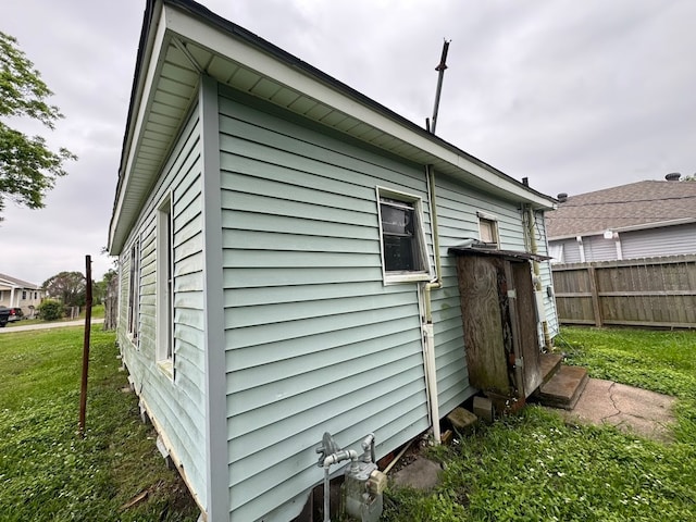 view of property exterior with a yard