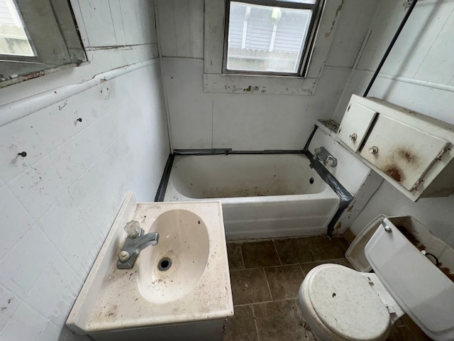 bathroom with vanity, toilet, and tile patterned floors