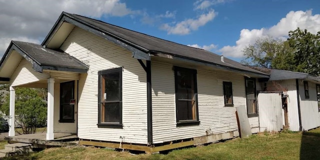 view of property exterior featuring a lawn