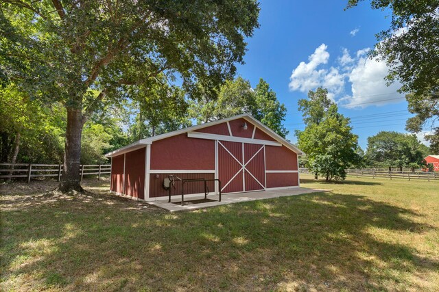 view of outdoor structure featuring a yard