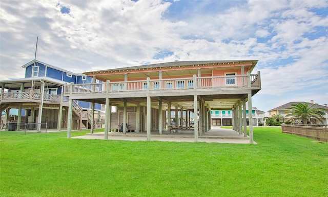 back of house featuring a yard and a patio area