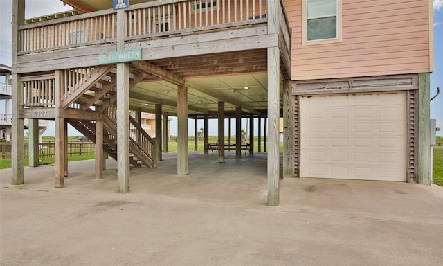 exterior space with a wooden deck and a garage