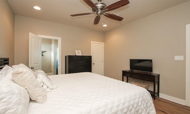 bedroom featuring wood-type flooring and ceiling fan