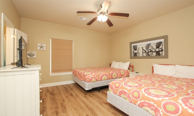 bedroom featuring light hardwood / wood-style floors and ceiling fan